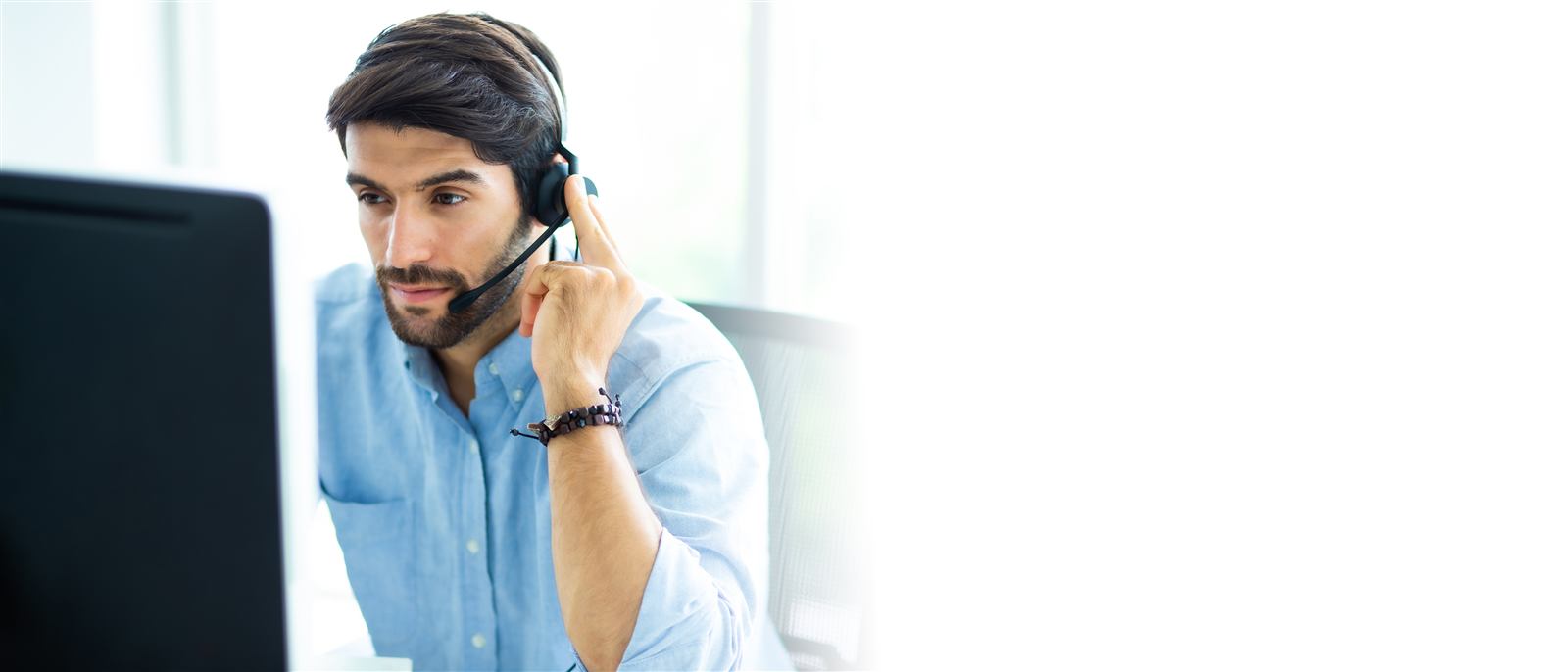 Sales agent on a call wearing a headset
